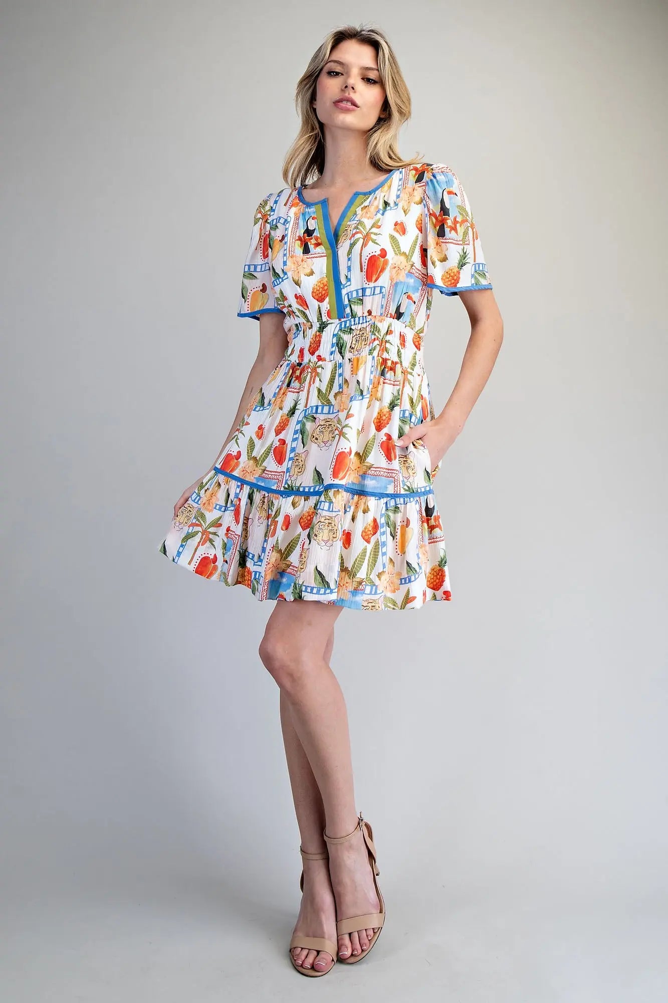Tropical inspired split v-neck mini dress with smocked waist