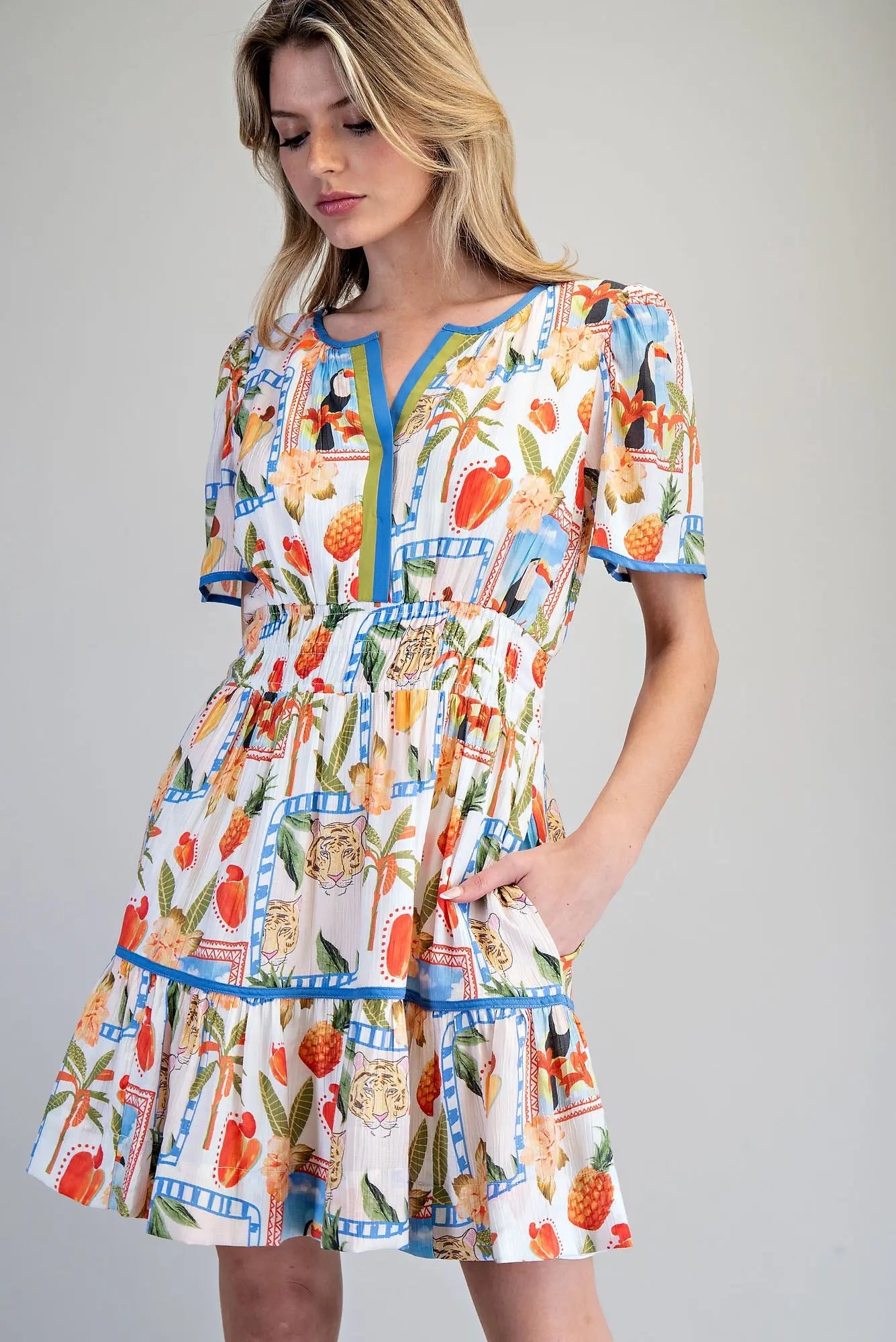 Tropical inspired split v-neck mini dress with smocked waist