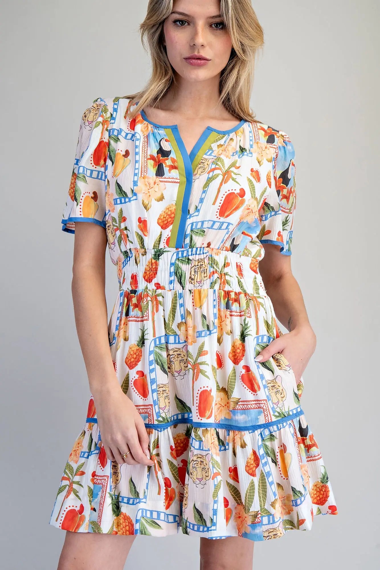 Tropical inspired split v-neck mini dress with smocked waist