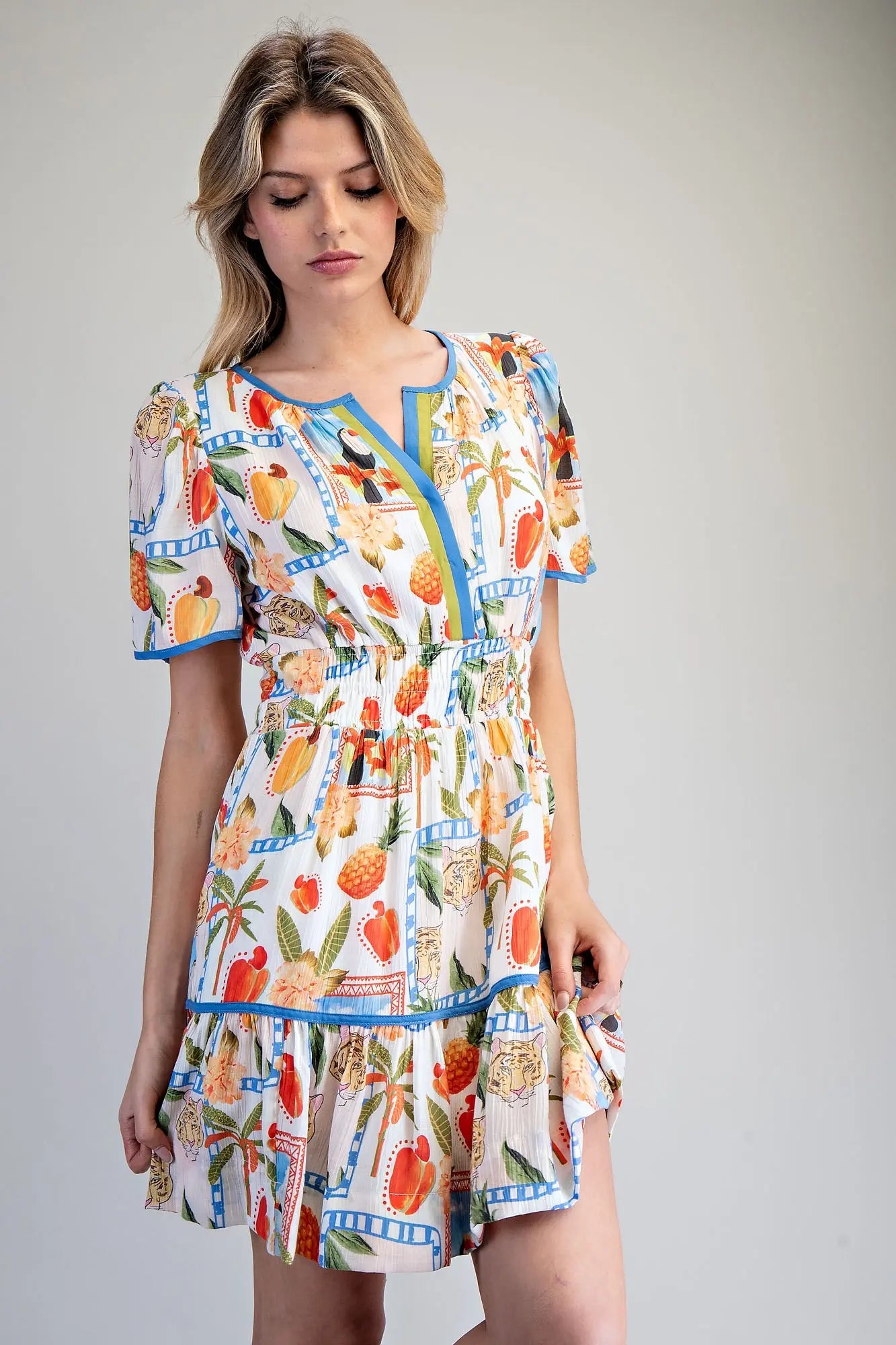 Tropical inspired split v-neck mini dress with smocked waist
