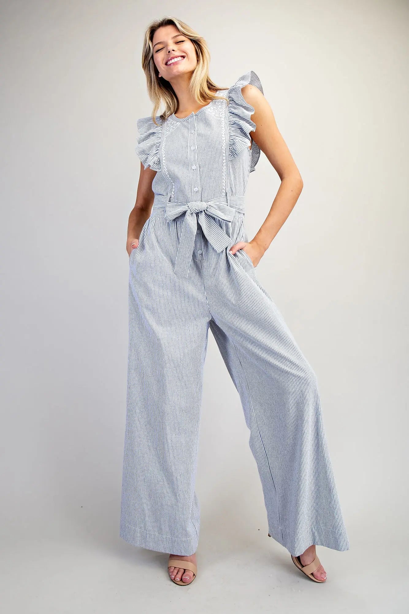 Striped ruffle shoulder jumpsuit with tie waist and wide leg