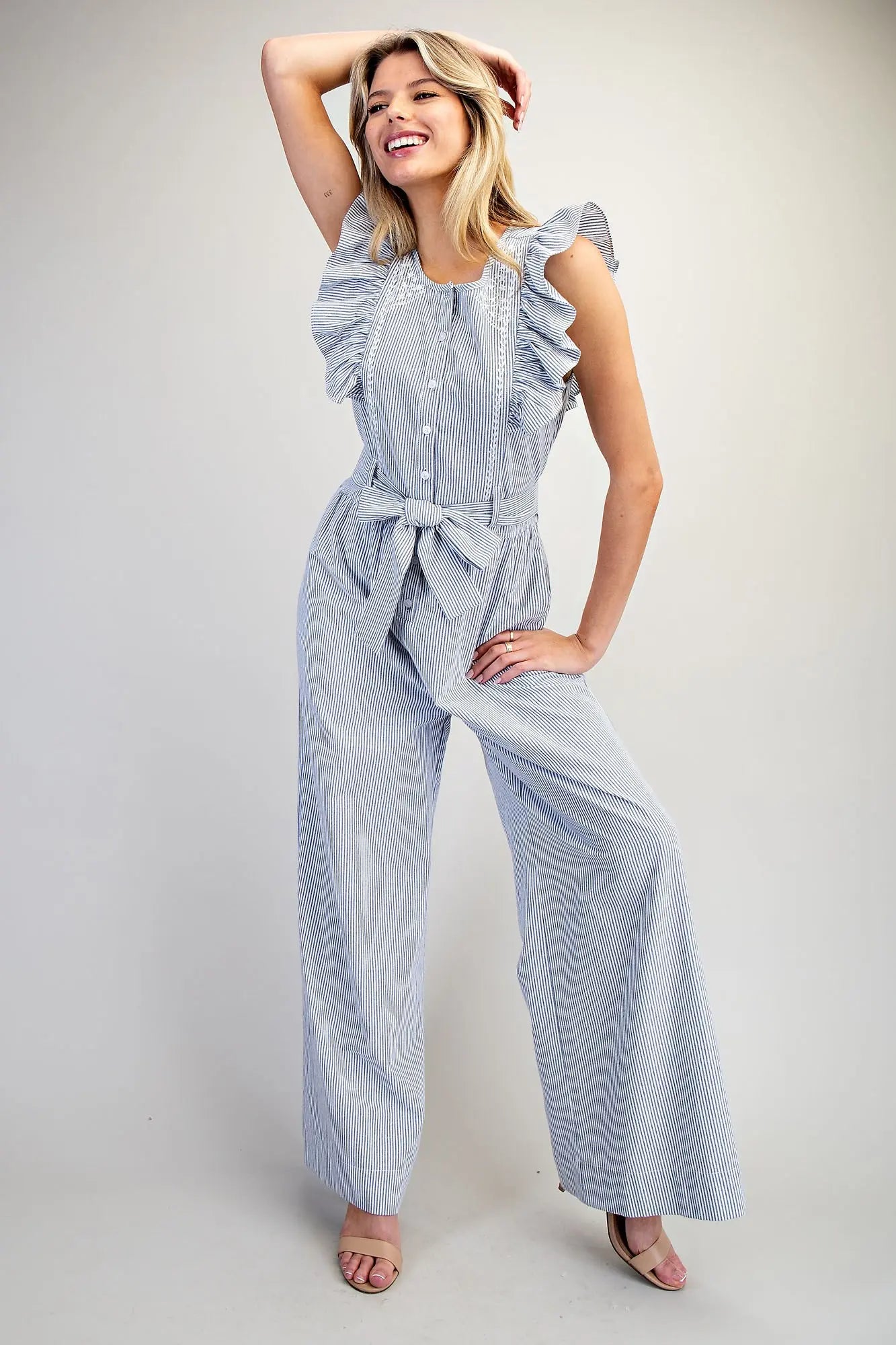 Striped ruffle shoulder jumpsuit with tie waist and wide leg