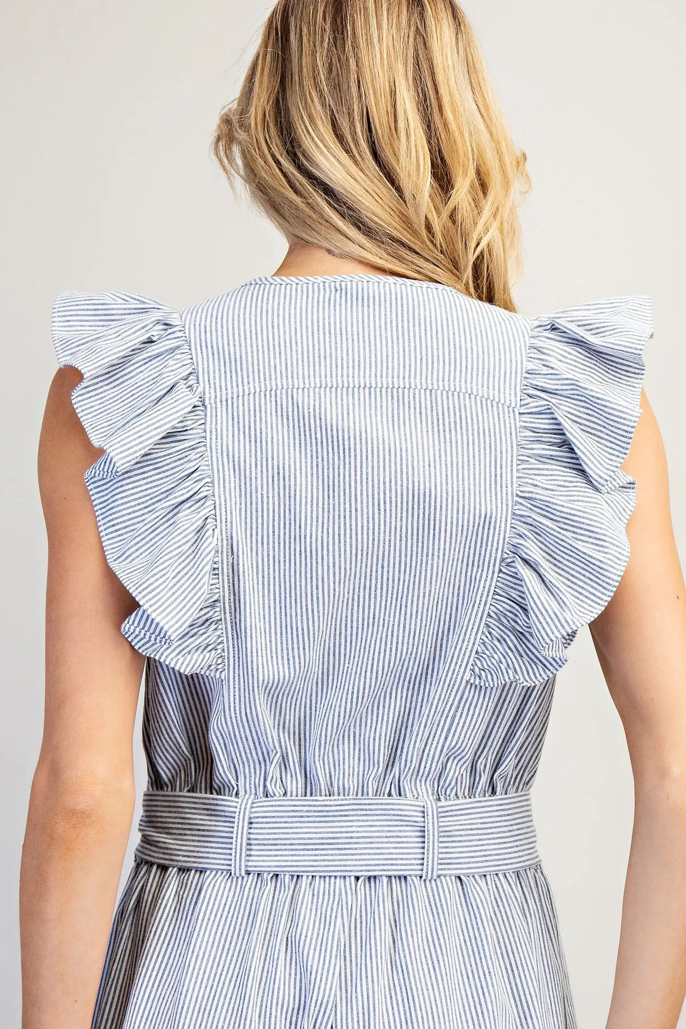 Striped ruffle shoulder jumpsuit with tie waist and wide leg