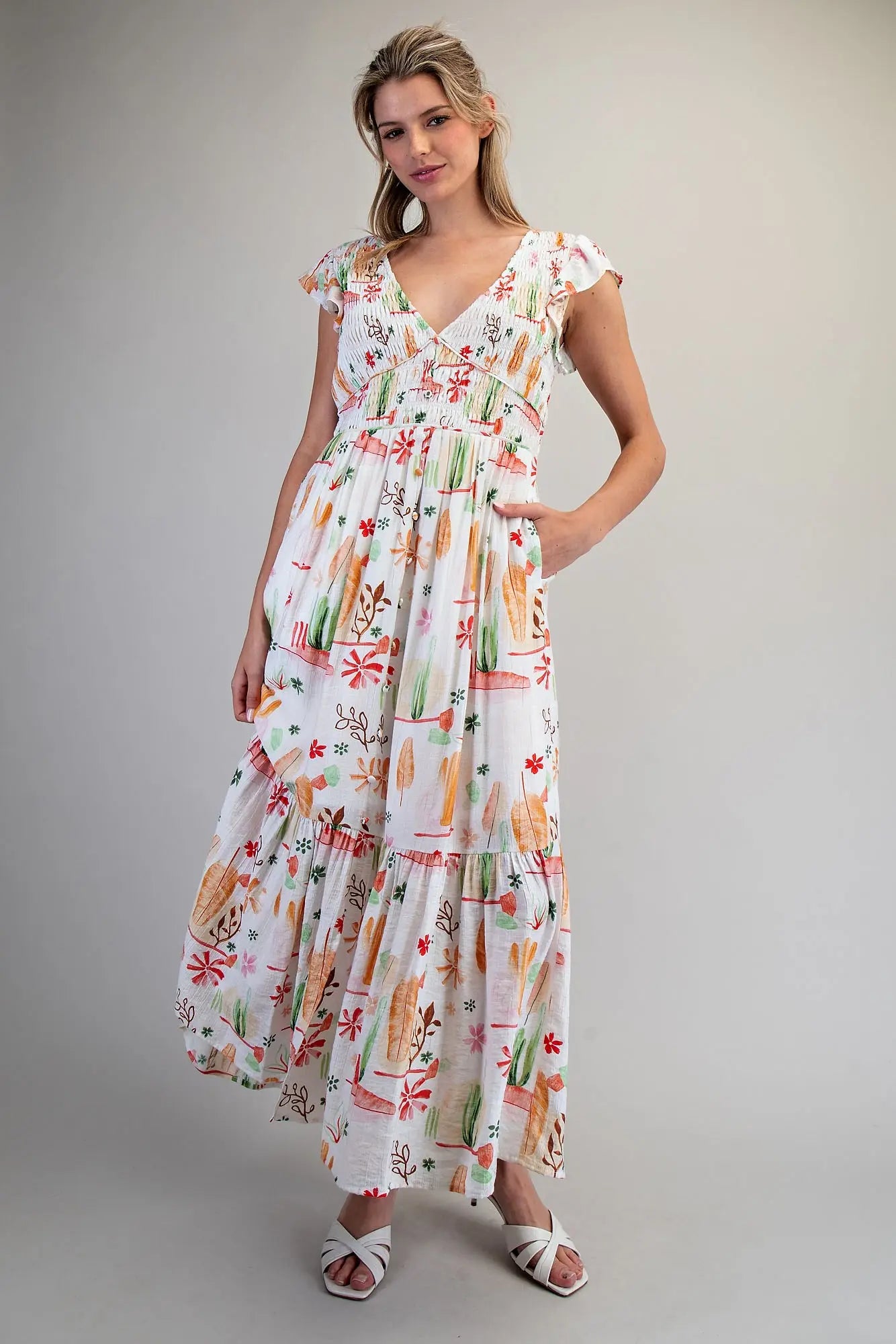 Desert inspired printed maxi dress with smocked bodice and ruffled flutter sleeves