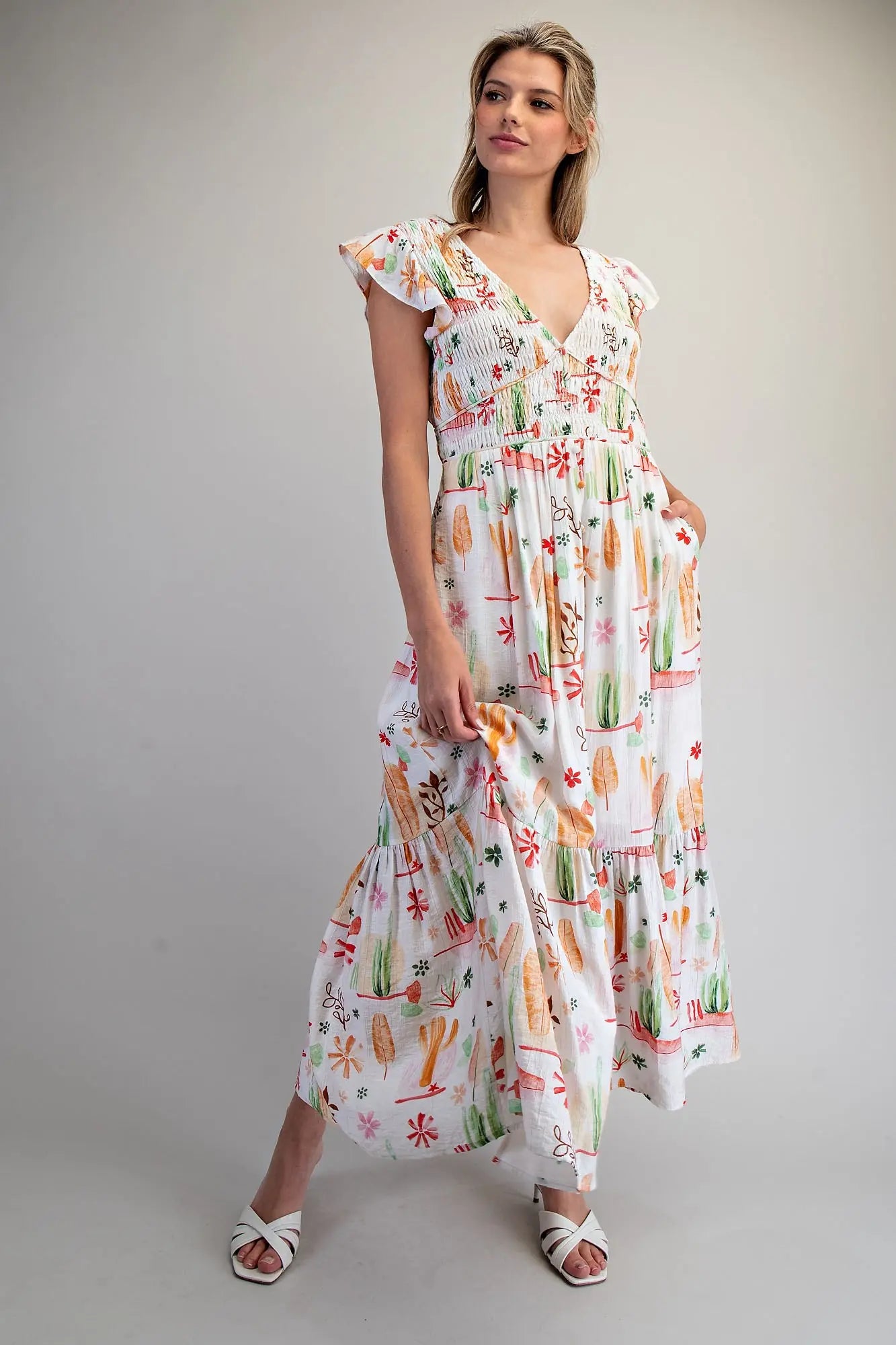 Desert inspired printed maxi dress with smocked bodice and ruffled flutter sleeves