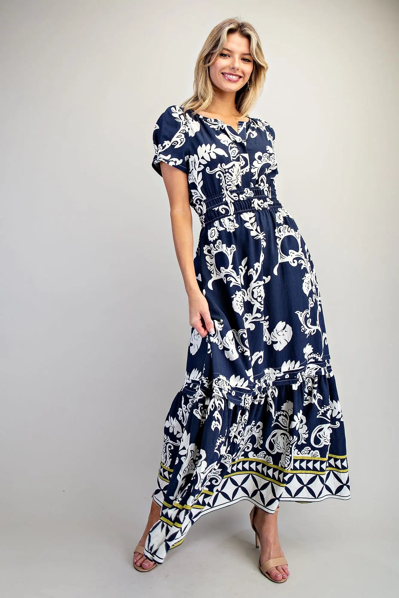 Printed maxi dress with puff sleeves and geometric border hem