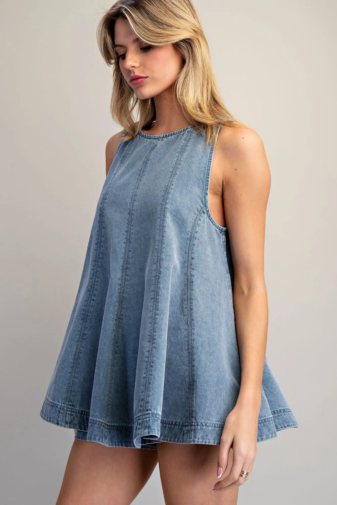 Sleeveless A-line denim top with high neckline