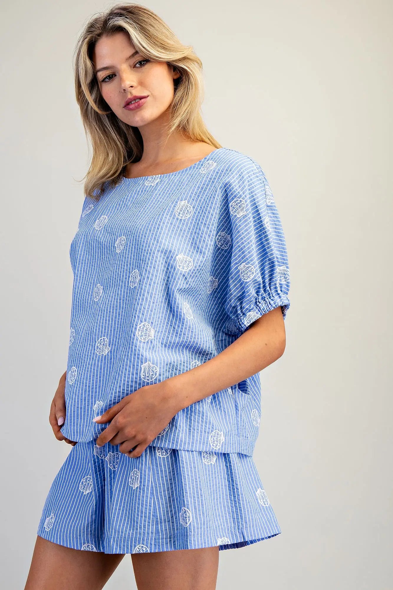 Seashell pinstriped top with boat neckline and dolman sleeves