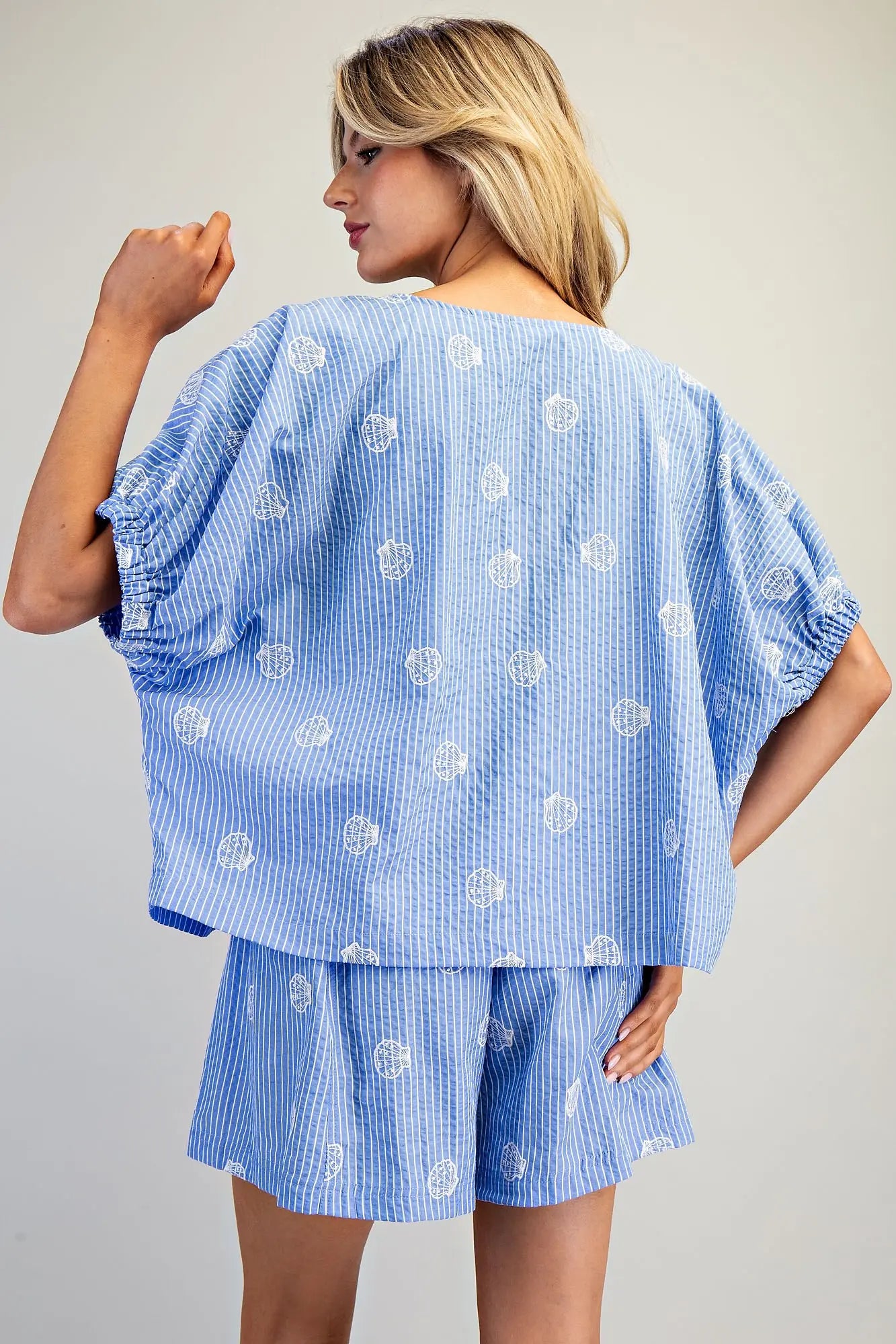 Seashell pinstriped top with boat neckline and dolman sleeves