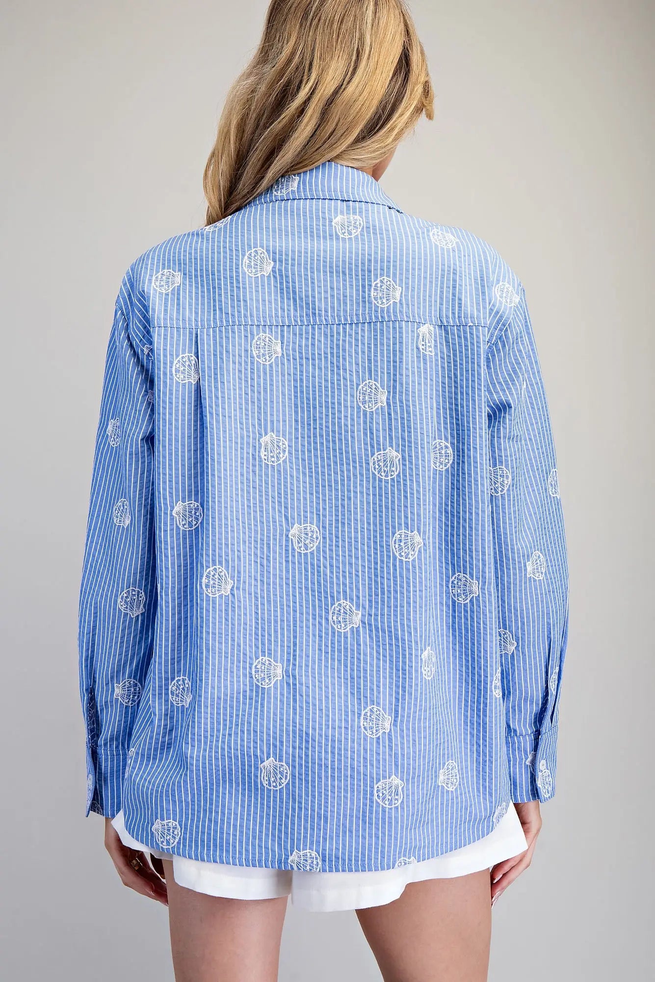 Blue and white striped button down shirt with seashell embroidery
