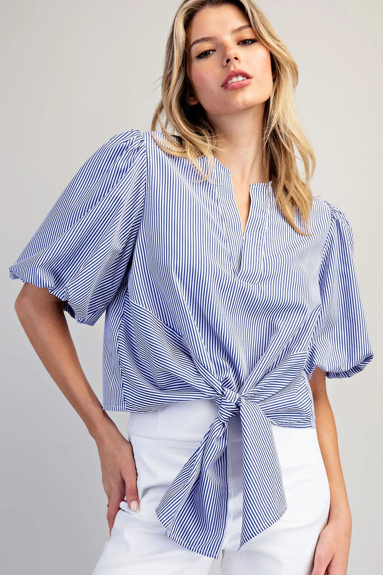 Women’s striped puff sleeve top with button back closure