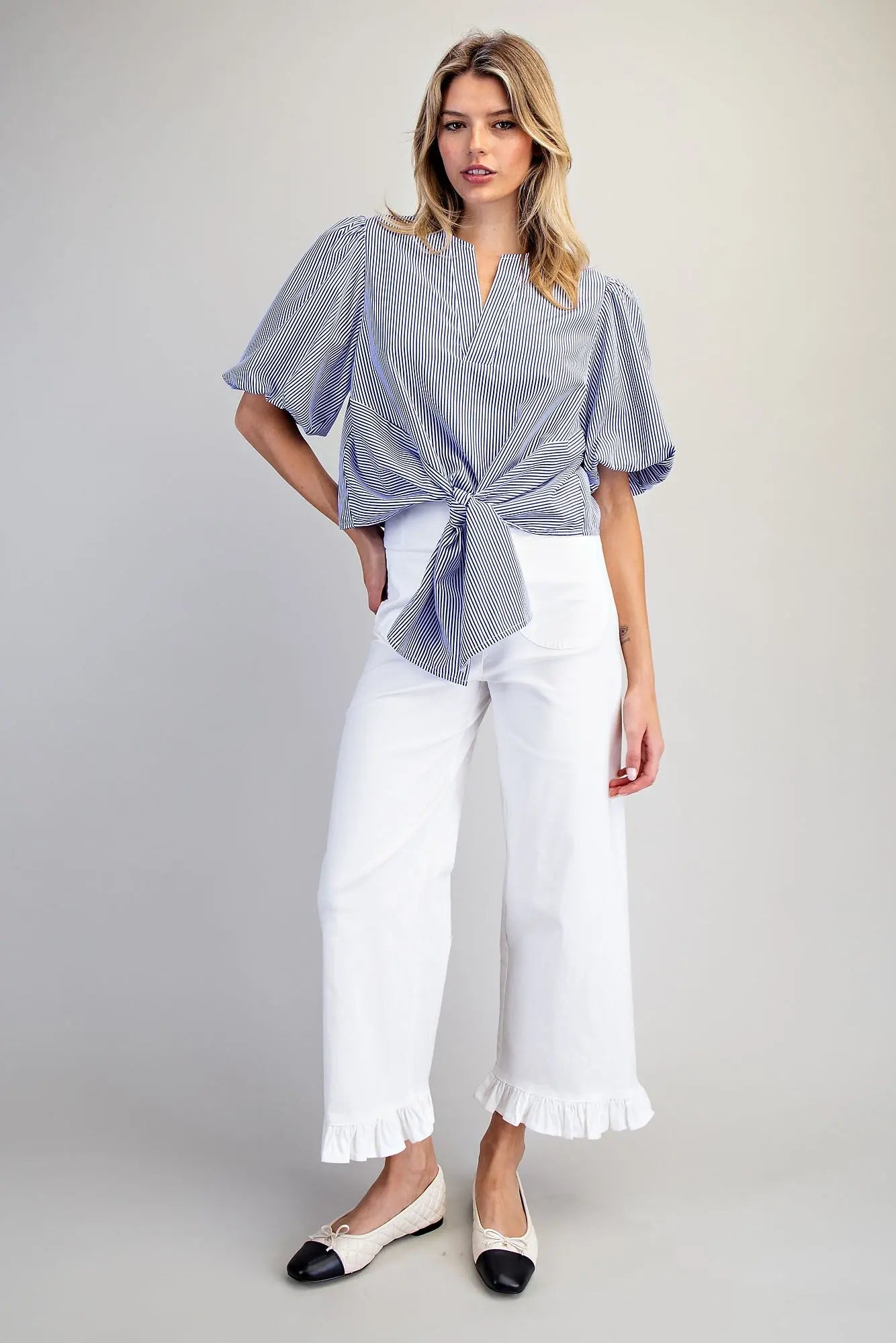 Women’s striped puff sleeve top with button back closure