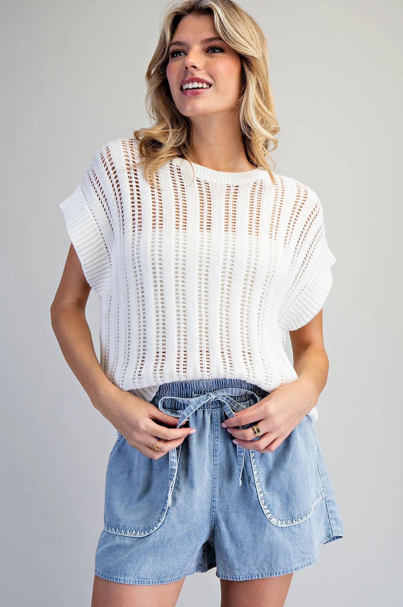 Snow washed drawstring shorts with zigzag trim pocket detail and relaxed fit, styled for a casual everyday look.