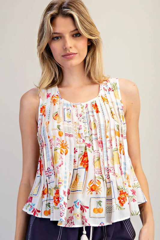  Pleated Blouse features a vibrant fruit and floral patchwork print with soft pleating and a breezy swing 