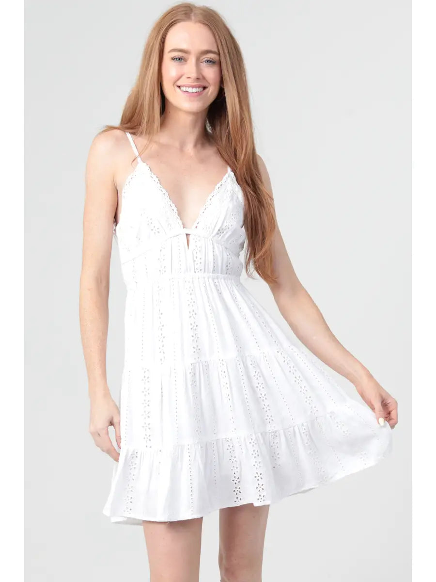 Eyelet embroidered mini dress with lace trim and an open tie back