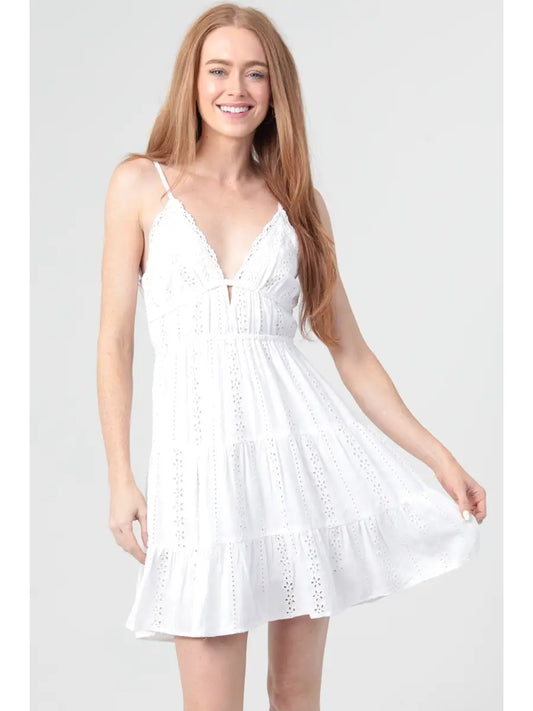 Eyelet embroidered mini dress with lace trim and an open tie back