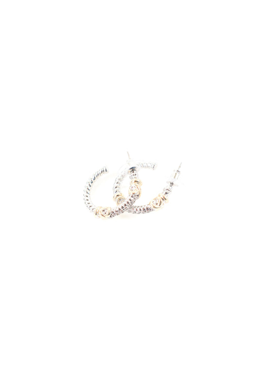 Mixed metal hoop earrings with gold bead accents and crystal detailing