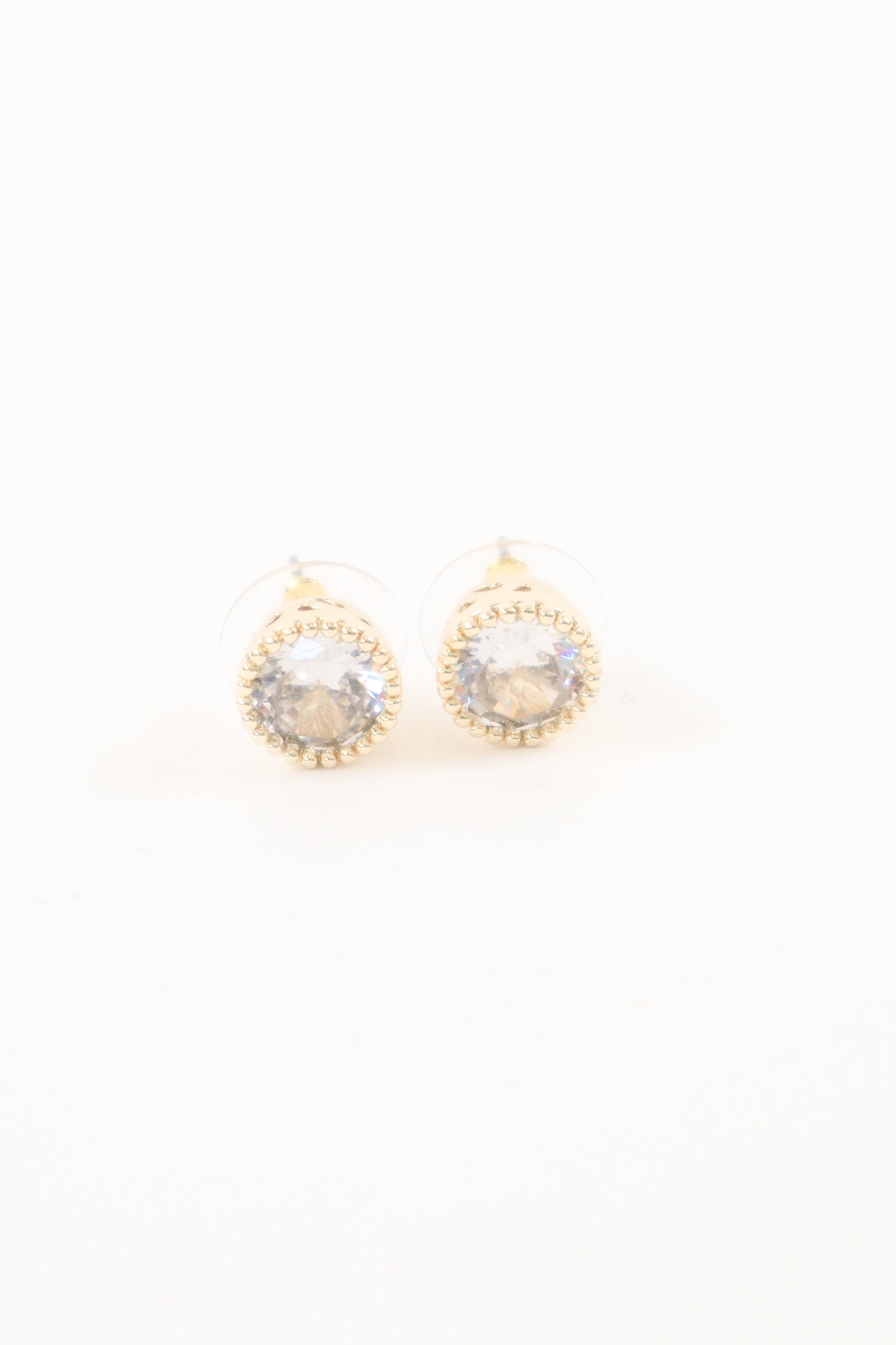 Gold round stud earrings with clear faceted crystal center and beaded trim