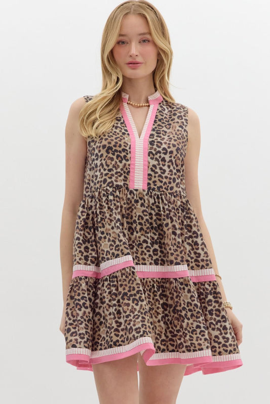 A bold and playful leopard print mini dress with tiered colorblock accents for a fun yet polished look.