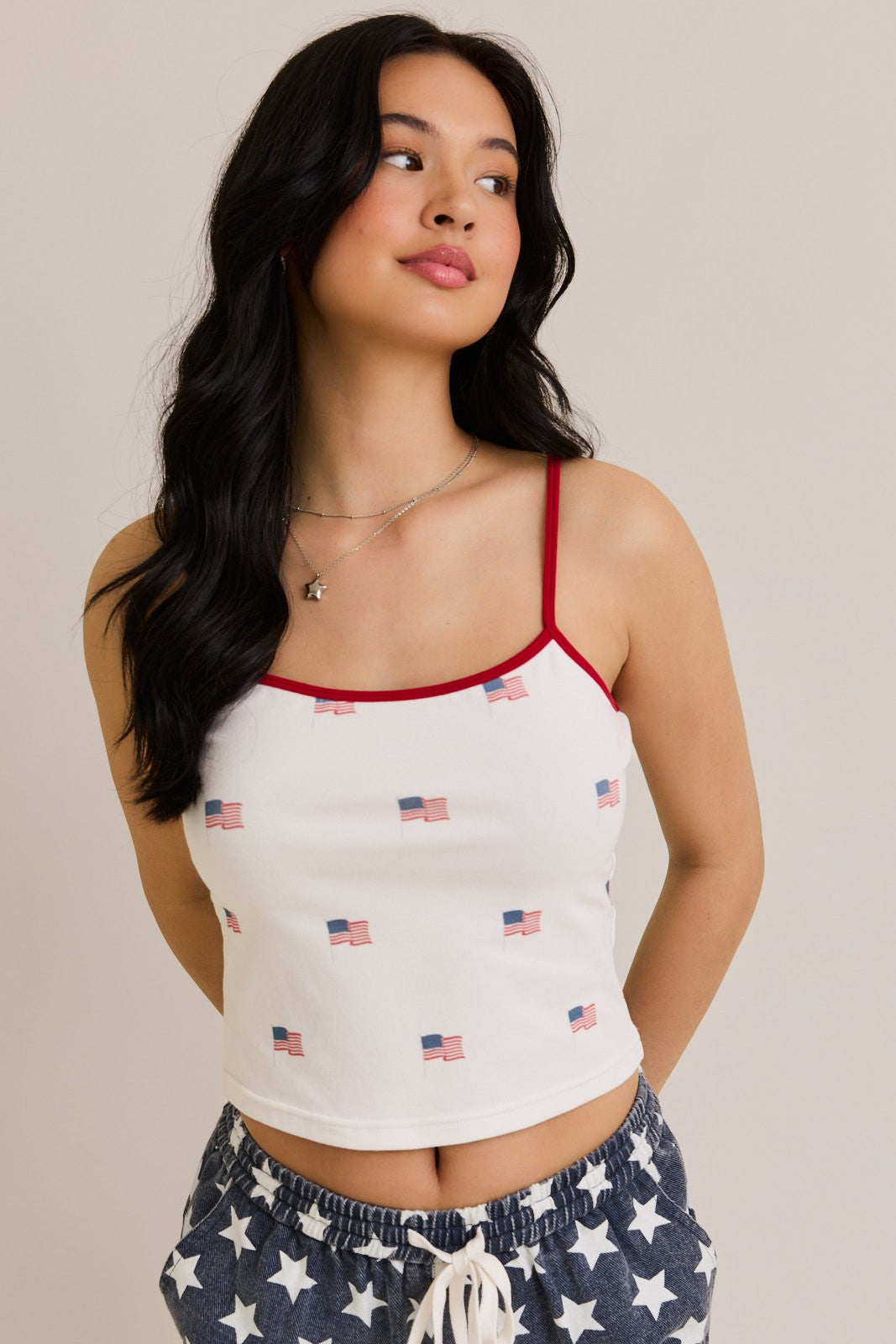 A bold, patriotic tank featuring a USA flag print and sporty contrast trim—perfect for summer days and festive weekends.