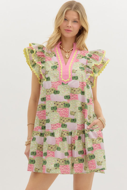 A breezy abstract print mini dress with flutter sleeves, contrast detailing, and tiered ruffle charm.
