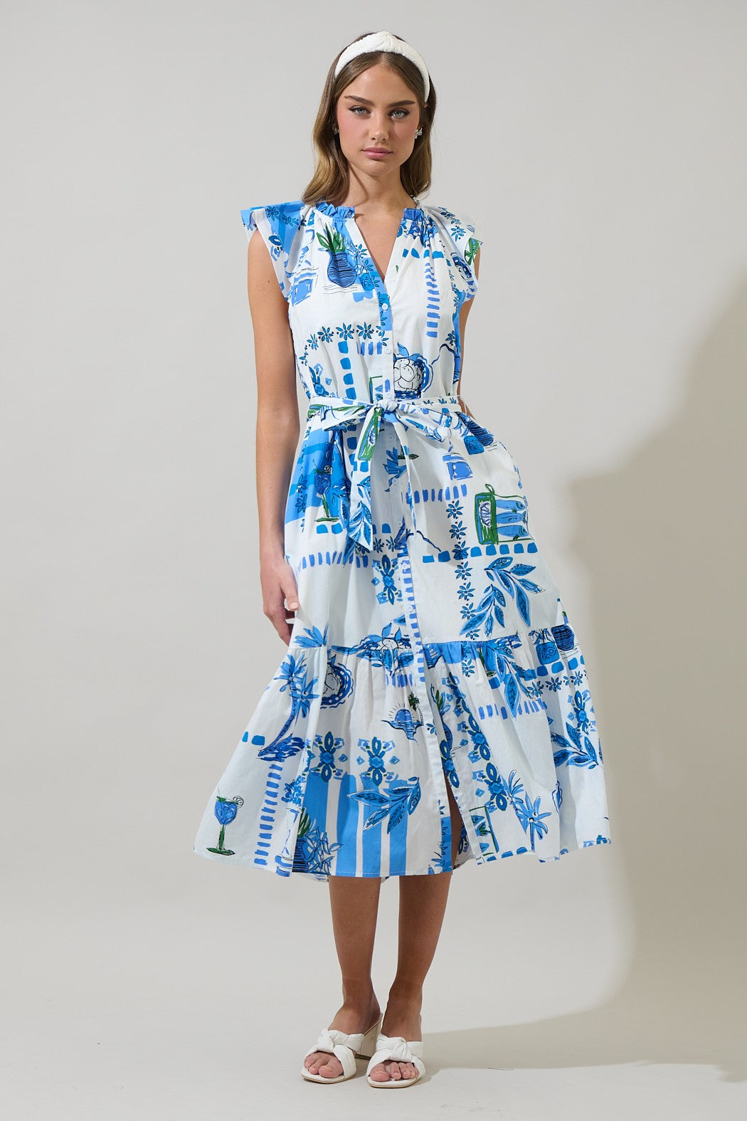 A breezy, belted midi dress with a flattering V-neckline and pockets—perfect for effortless style on the go.