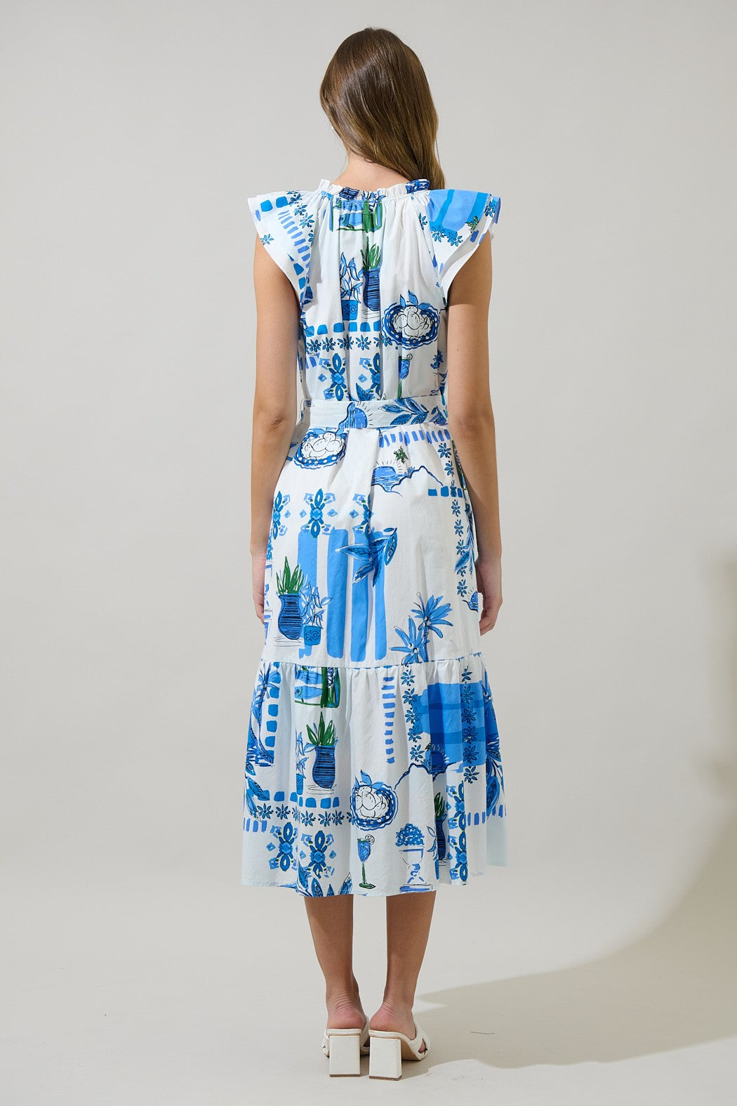 A breezy, belted midi dress with a flattering V-neckline and pockets—perfect for effortless style on the go.