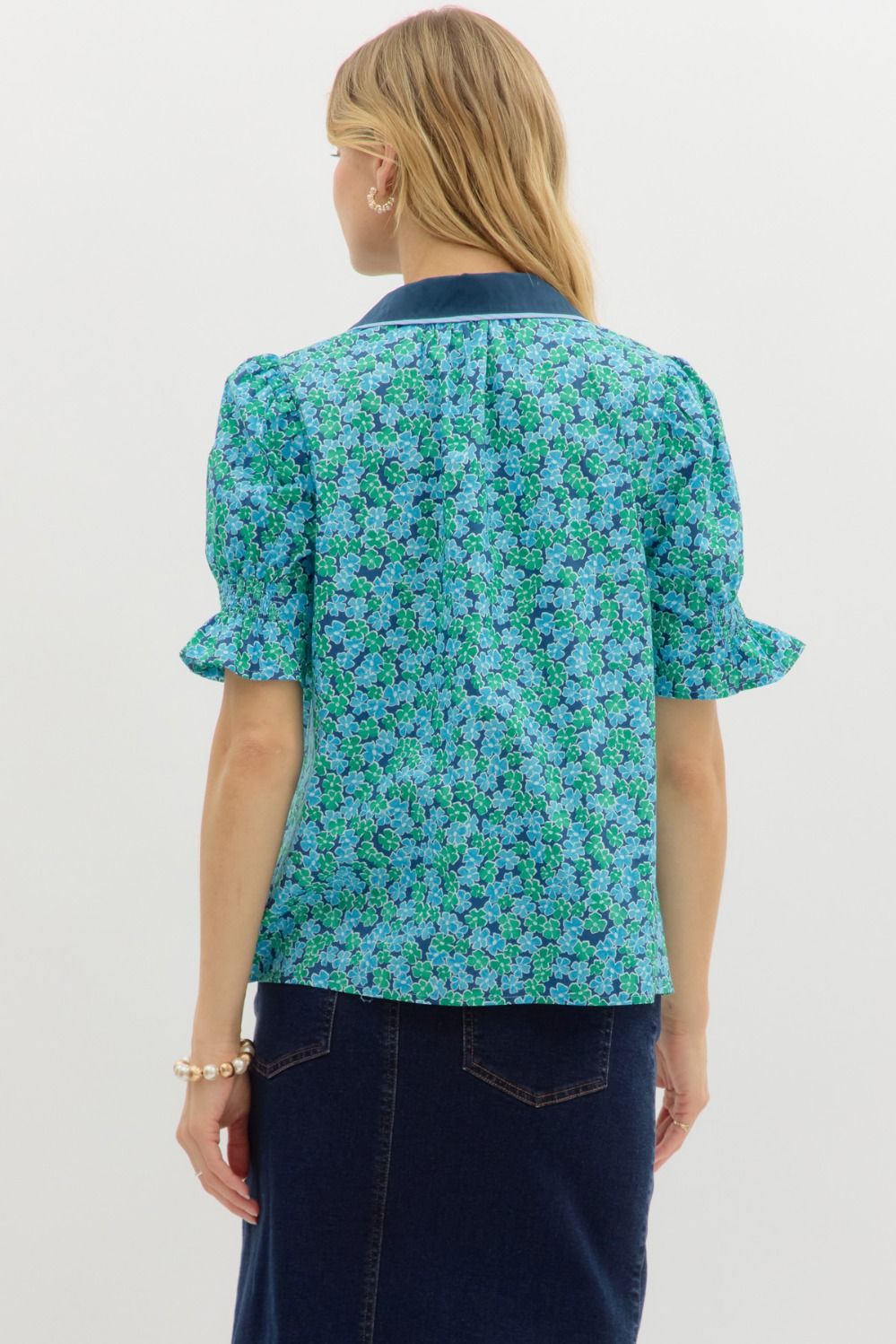 A charming floral pullover top with puff sleeves, contrast binding, and a smocked detail for comfort.

