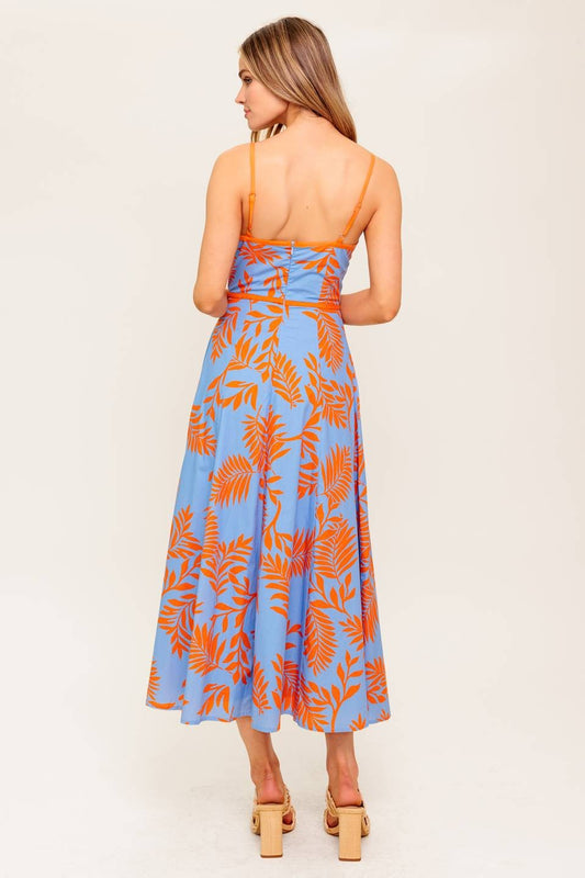 A cotton printed midi dress with a flattering waist cut-out and a flowing circle skirt.

