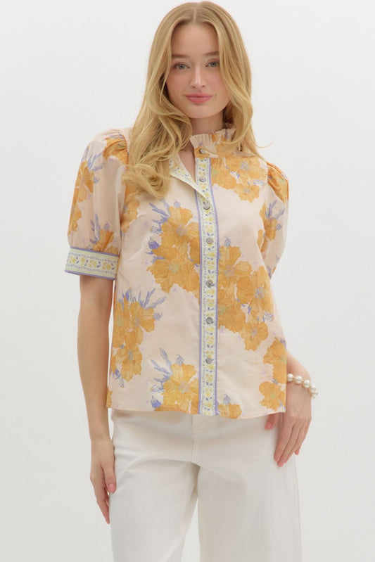 A delicate, floral print top that brings a touch of femininity and comfort to any outfit.
