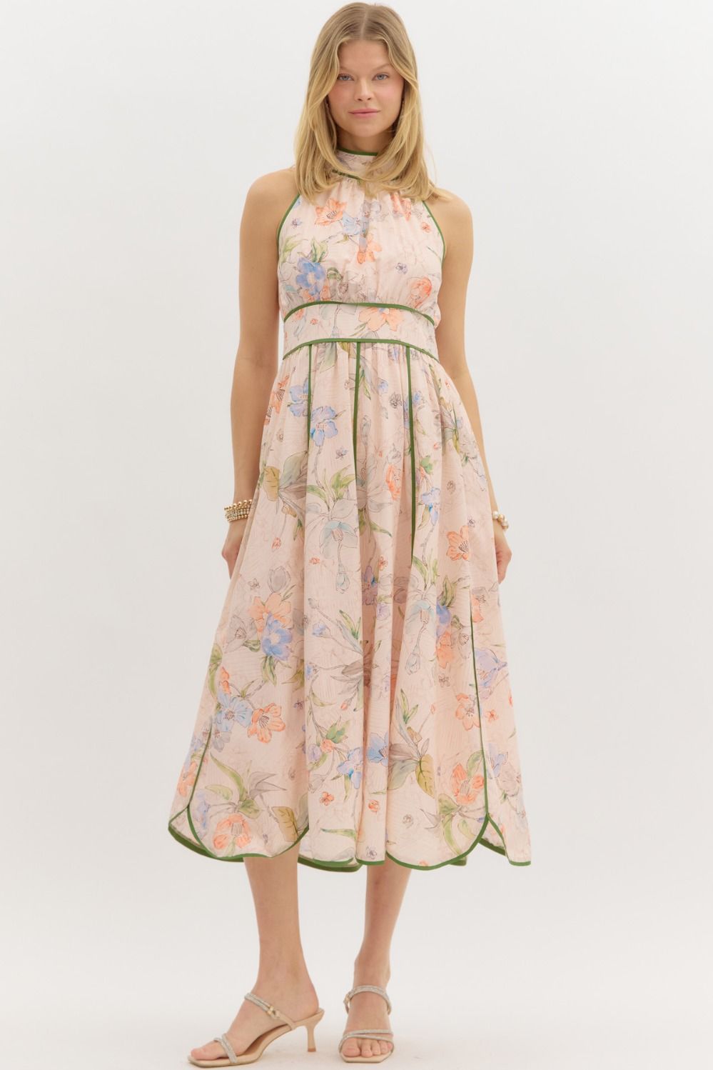 A floral halter midi dress with contrast binding and a flattering smocked waist.