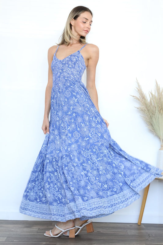 A flowing maxi dress featuring a flattering V-neck and smocked bodice for a comfortable, elegant fit.

