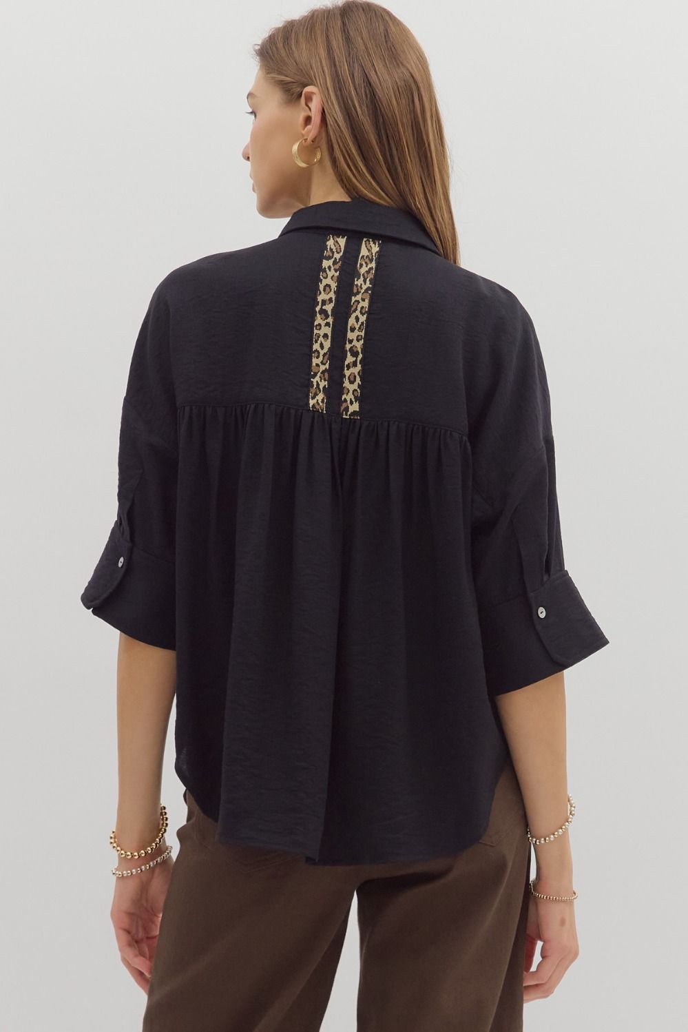 A lightweight cuff sleeve shirt with playful animal print trim—perfect for casual polish and standout detail.