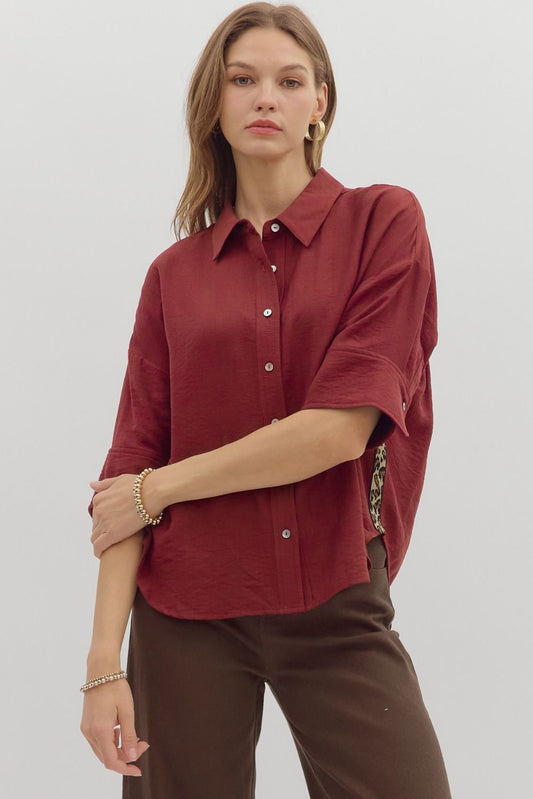 A lightweight cuff sleeve shirt with playful animal print trim—perfect for casual polish and standout detail.