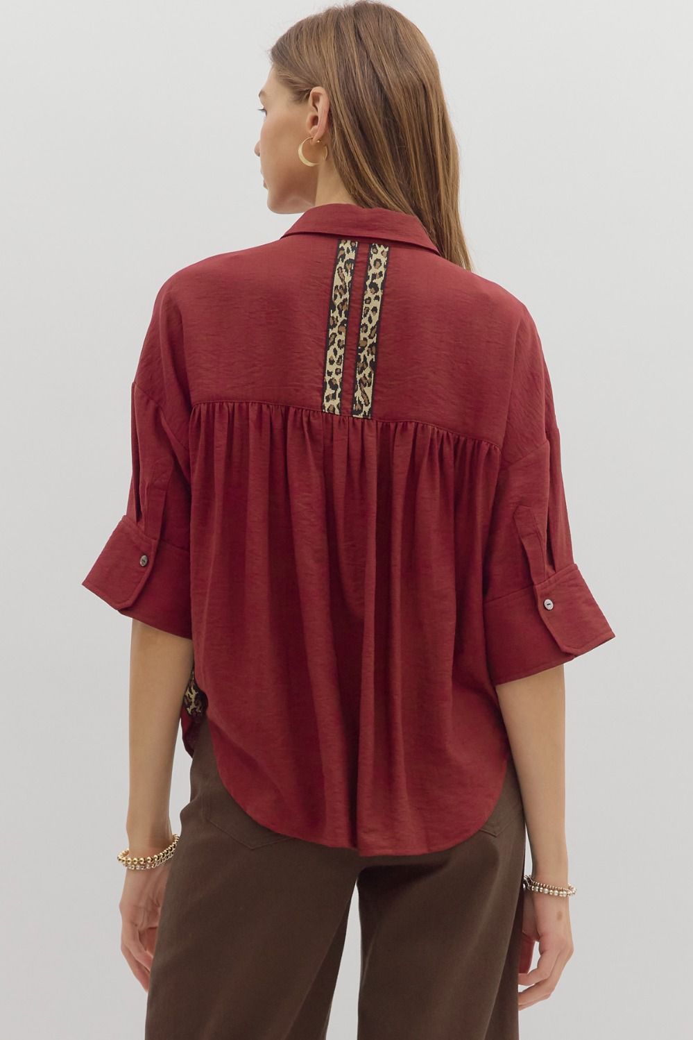A lightweight cuff sleeve shirt with playful animal print trim—perfect for casual polish and standout detail.