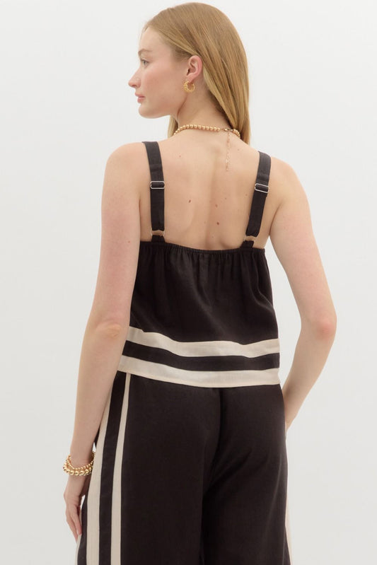 A lightweight pullover top with adjustable wide straps and a bold abstract border accent.
