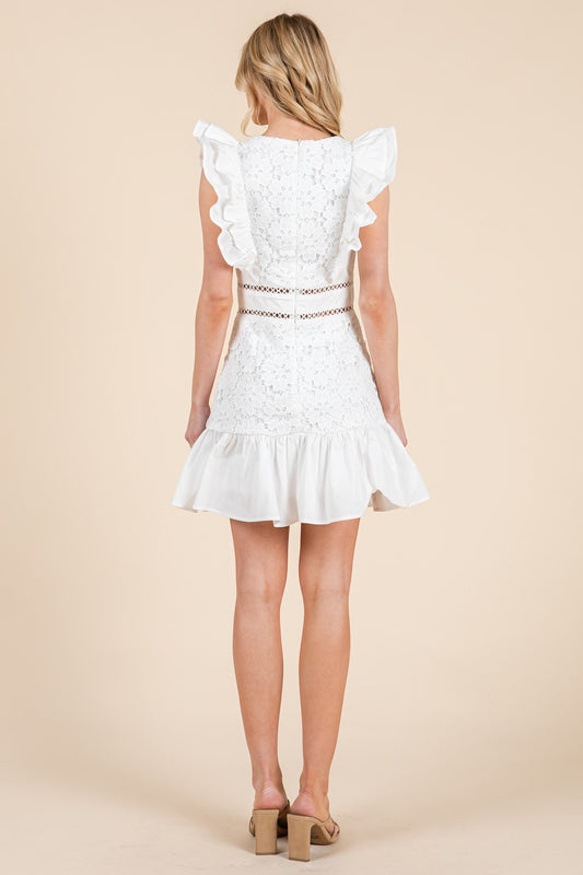 A romantic lace mini dress with ruffle sleeves and delicate waist detailing.