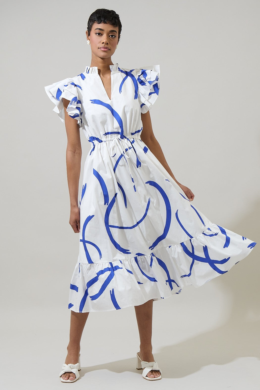 A ruffled, romantic midi dress with a drawstring waist and cap sleeves—perfect for turning heads in any setting.