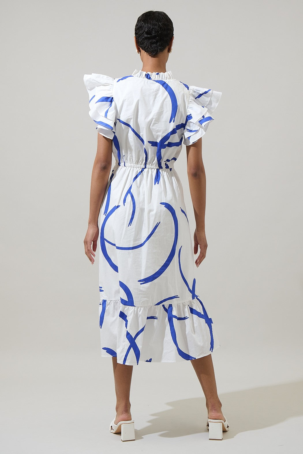 A ruffled, romantic midi dress with a drawstring waist and cap sleeves—perfect for turning heads in any setting.