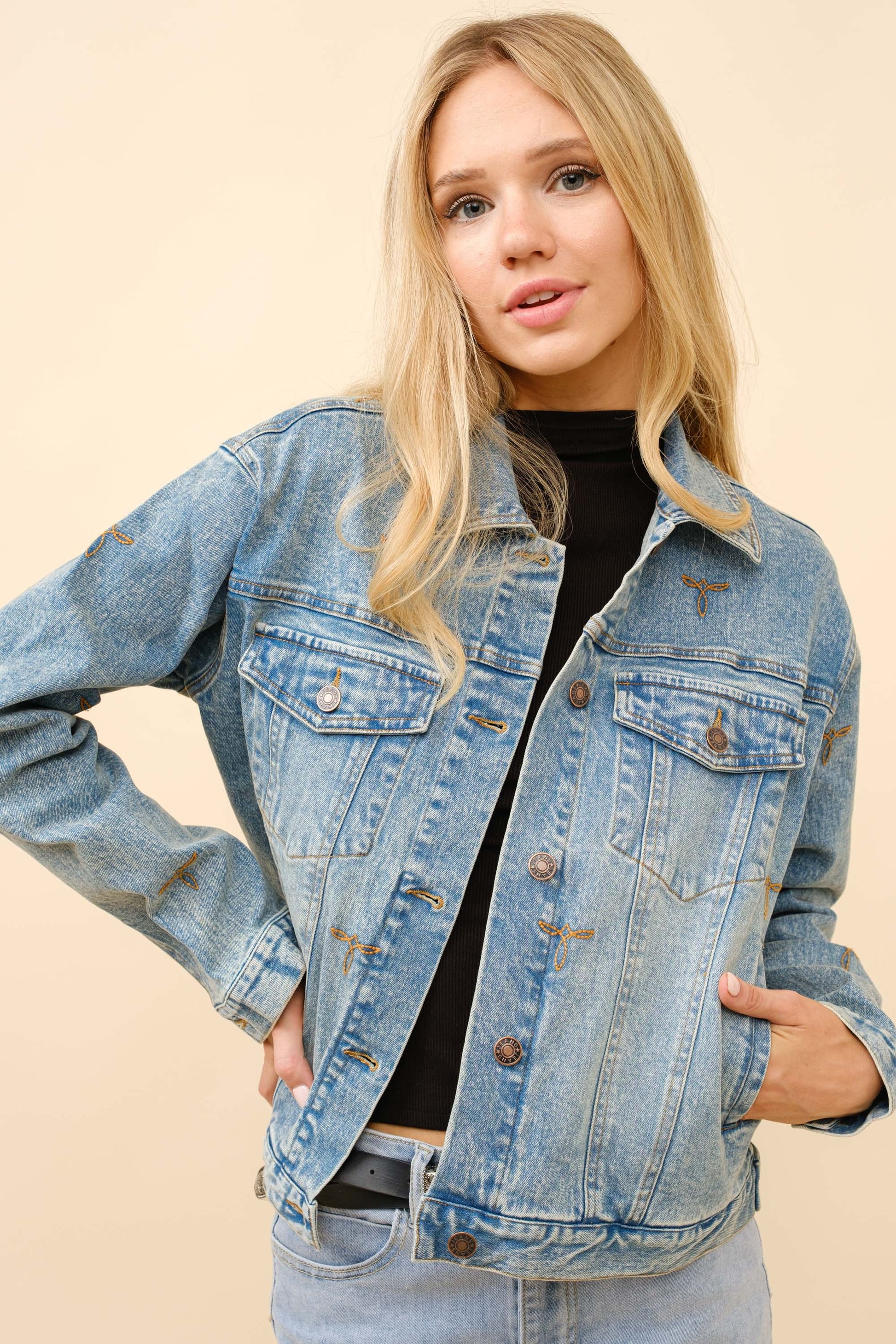 A rugged, boot-stitched denim trucker jacket with a relaxed, layer-ready fit.

