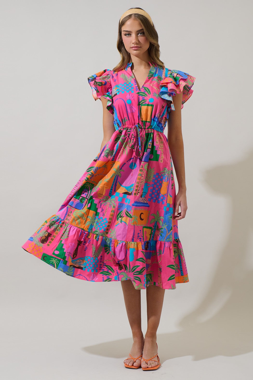 A stylish, ruffled midi dress with a flattering V-neckline and adjustable tie waist—perfect for dressing up or down.