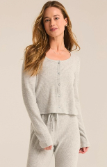 A soft, heather gray thermal Henley top with a button-front design, cropped fit, and long sleeves, styled for cozy and casual wear.