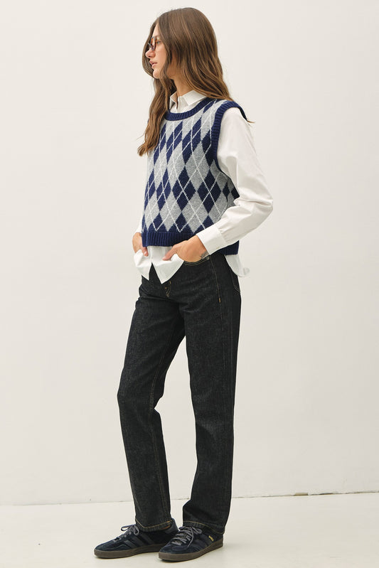 a navy and light gray argyle sweater vest over an attached white collared shirt