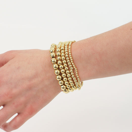 14k gold-filled stacked bracelets] | "Luxury gold beaded bracelets stacked together
