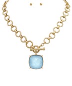  toggle necklace with a cushion-cut gemstone pendant, available in multiple colors.