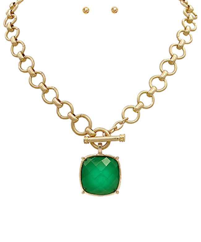  toggle necklace with a cushion-cut gemstone pendant, available in multiple colors.