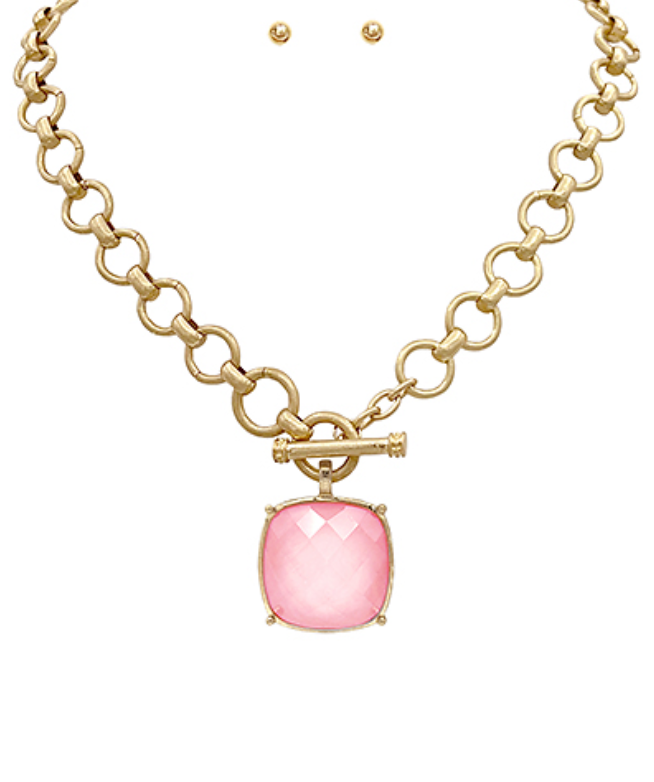  toggle necklace with a cushion-cut gemstone pendant, available in multiple colors.
