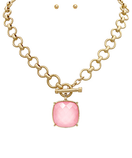  toggle necklace with a cushion-cut gemstone pendant, available in multiple colors.