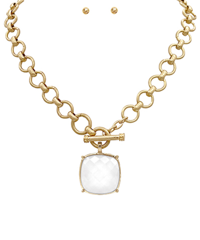  toggle necklace with a cushion-cut gemstone pendant, available in multiple colors.