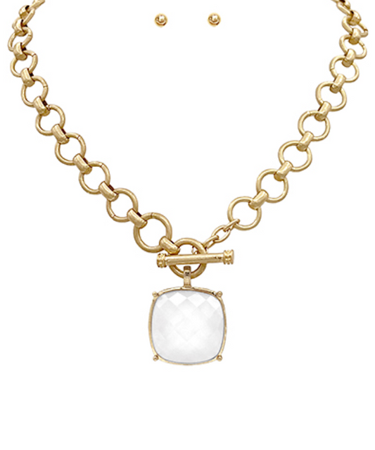  toggle necklace with a cushion-cut gemstone pendant, available in multiple colors.